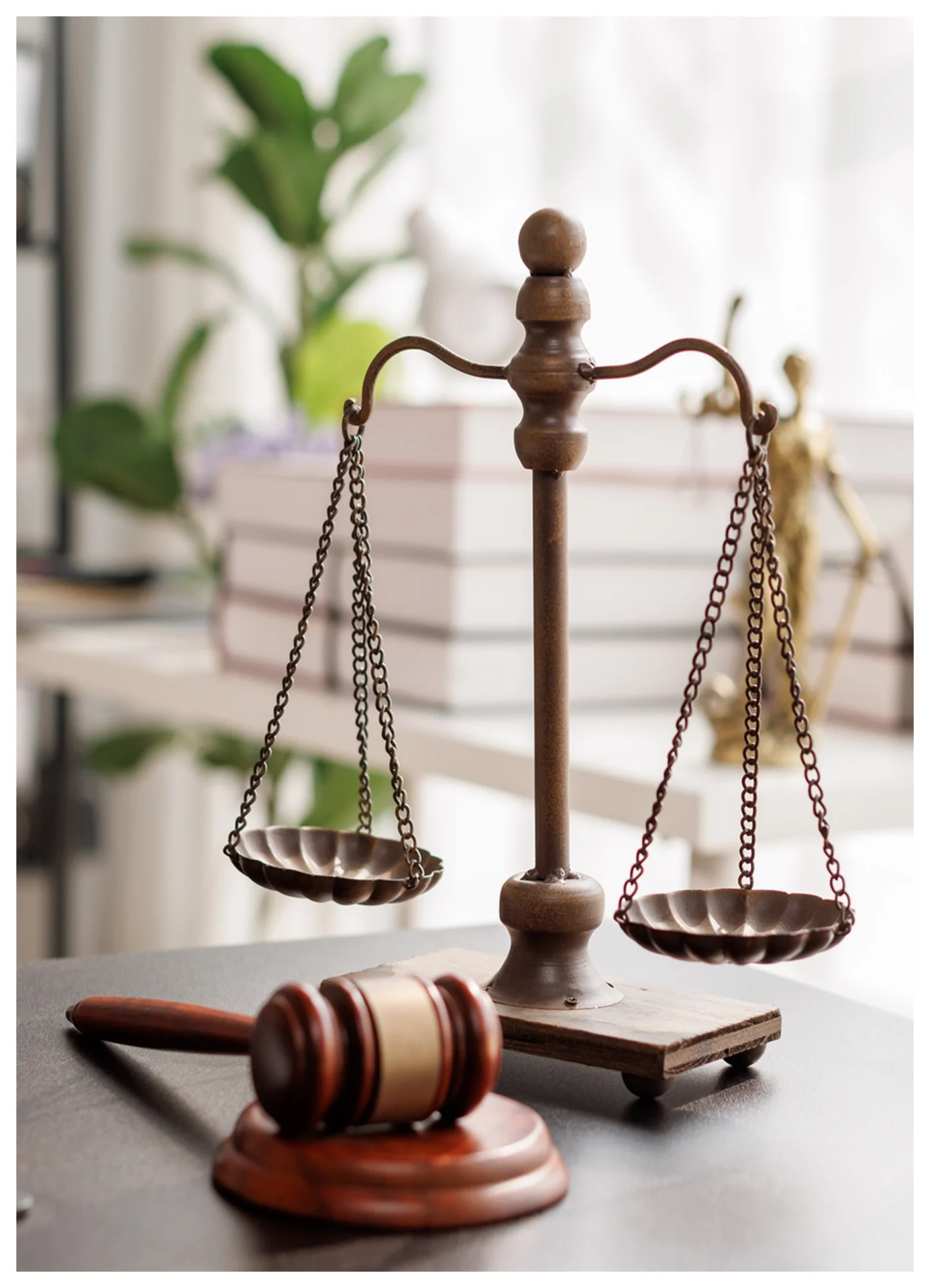 Scales of justice and gavel on desk.